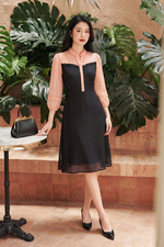 Đầm đen dáng xòe phối màu cam tay lỡ